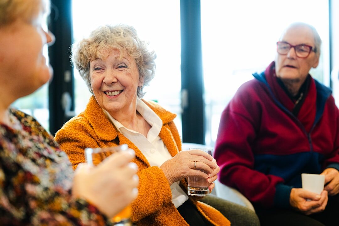 seniors playing cards indoors